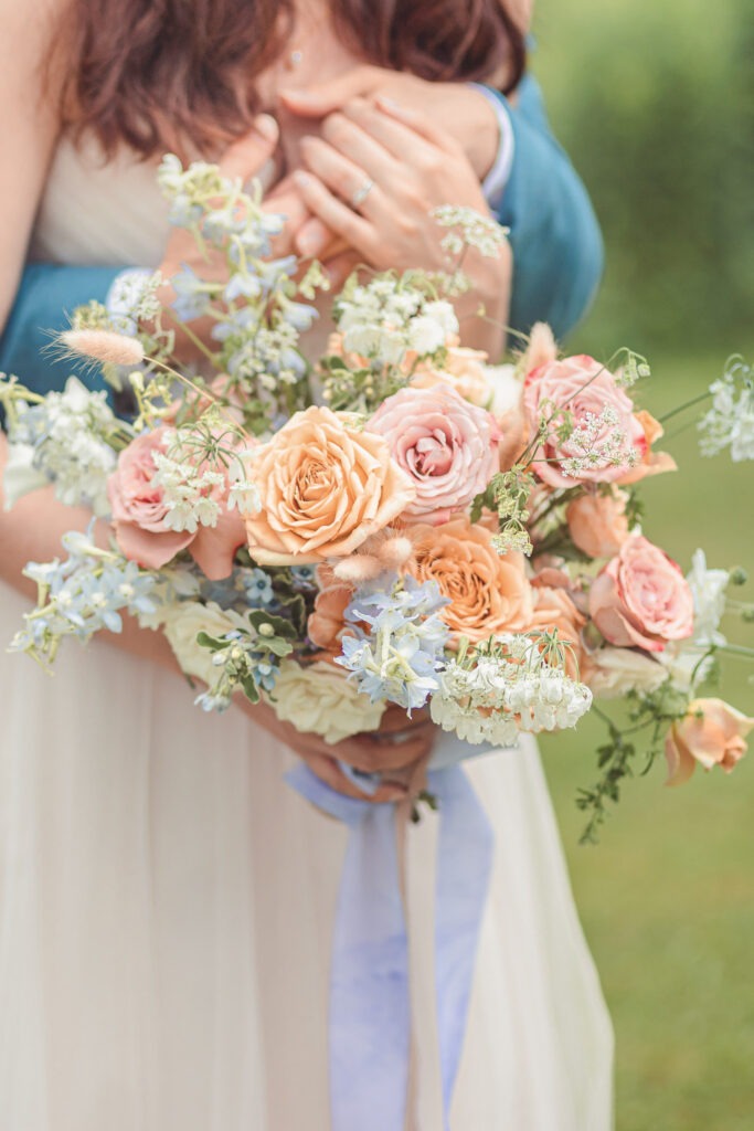 a person holding a bouquet of flowers